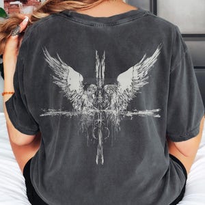 Angels at the Cross grunge style design printed on a Comfort Colors distressed premium quality tee, 100 percent cotton
