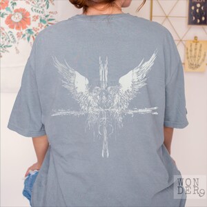 Angels at the Cross grunge style design printed on a Comfort Colors distressed premium quality tee, 100 percent cotton