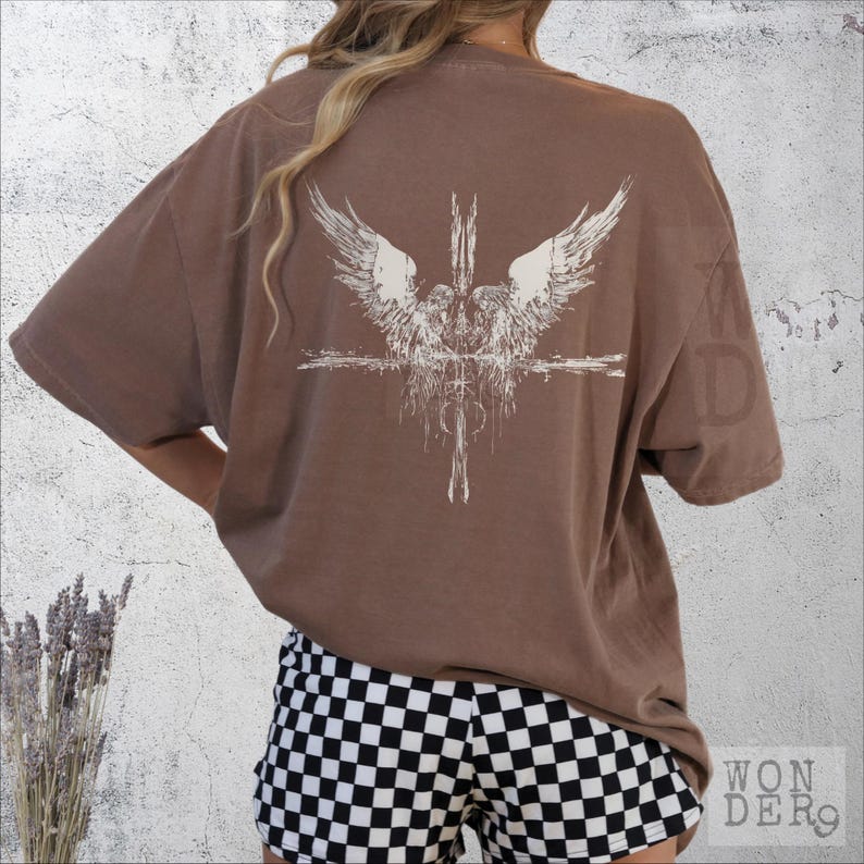 Angels at the Cross grunge style design printed on a Comfort Colors distressed premium quality tee, 100 percent cotton