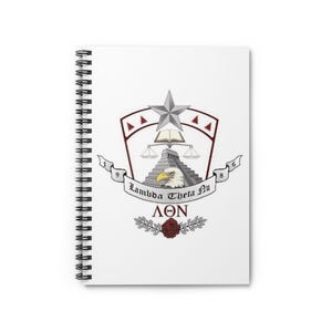 May include: A white spiral notebook with a black and white image of a crest. The crest features a star, a book, a scale, a pyramid, an eagle, and the text "Lambda Theta Nu 1986". Below the crest is the text "ΛΘΝ" and a red rose with green leaves.
