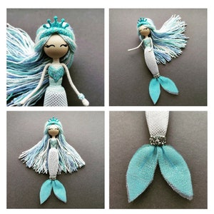 May include: A handmade mermaid doll with a blue and white yarn hair, a blue glitter crown, and a blue glitter tail. The doll is made of wood and has a white mesh bodice.