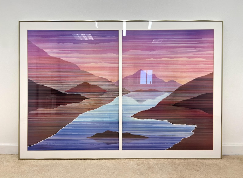May include: Large framed artwork depicting a landscape with mountains, a river, and a sunset. The artwork is divided into two panels and features a color palette of purples, pinks, blues, and browns. The frame is gold-colored.