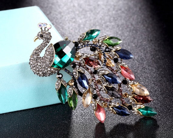 Schumacher Broche veelkleurig elegant Sieraden Broches Schumacher Broche veelkleurig elegant Sieraden Broches