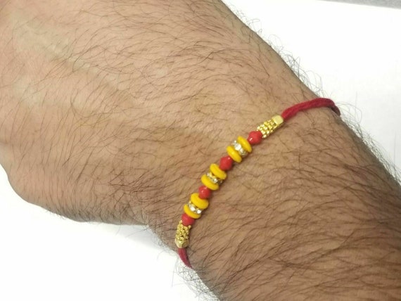 What does the red thread Hindus wear in their wrist mean  Quora