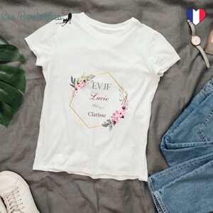 May include: White t-shirt with a gold hexagonal frame with a floral design and the text "EVJF Lucie Clarisse" in gray and burgundy.