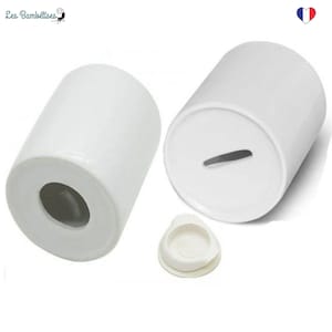May include: Two white ceramic money boxes with a slot on the top and a removable lid. The money boxes are cylindrical in shape.
