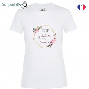 May include: White t-shirt with a gold geometric frame and floral design. The text "EVJF Juliette Amandine" is inside the frame.