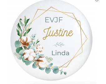 May include: White round sticker with a gold geometric frame and green floral design. The text "EVJF Justine Linda" is inside the frame.