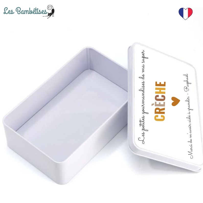 May include: A white rectangular tin box with a lid. The lid has text in French that says "Les petites gourmandises de ma super CR&Egrave;CHE" and "Merci de m'avoir aid&eacute; &agrave; grandir - Rapha&euml;l". A small brown heart is also on the lid.