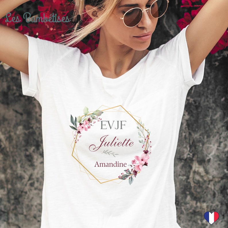 May include: White t-shirt with a gold hexagonal frame with floral accents and the text "EVJF Juliette Amantine".