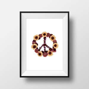 May include: A framed print of a peace sign made of flowers. The peace sign is made of yellow sunflowers and purple and red flowers.
