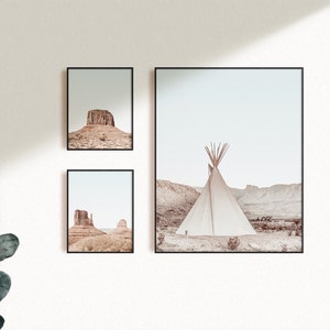 May include: Three framed prints of desert landscapes. The left and right prints feature rock formations in a desert setting. The center print features a white teepee in a desert landscape.