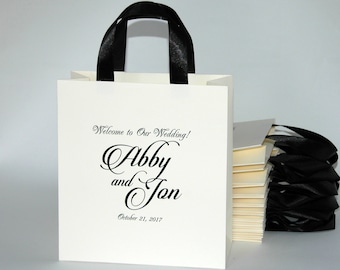 25 bolsas de bienvenida de color marfil con asas de cinta de raso y nombres - Bolsas de bienvenida de boda para invitados - Regalos y favores de boda personalizados elegantes