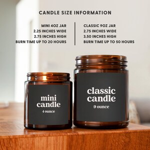 a couple of candles sitting on top of a wooden table