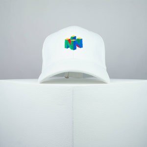 May include: White baseball cap with a colorful Nintendo logo embroidered on the front.
