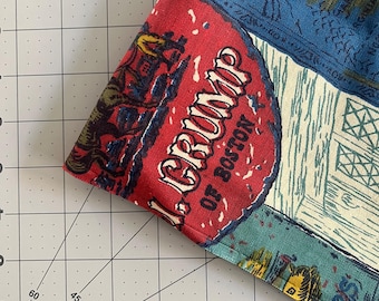 May include: A red, white, and blue fabric with a map of the world and the text "J. Grubb, Old Boston" printed on it.