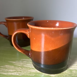 Set of Two Vibrant 1970s Orange Black and Brown Coffee Tea Mugs Cups