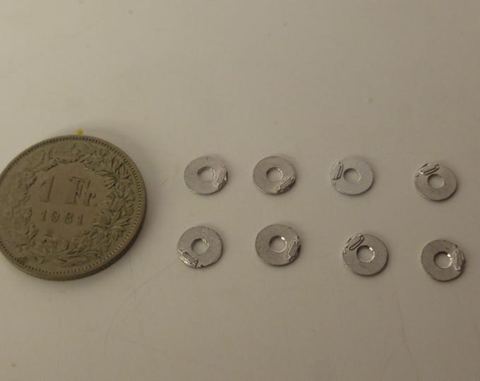 1:43 scale white metal brake discs with calliper moulded in (pack of 8 pieces)