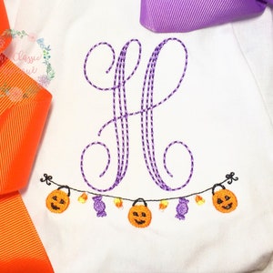 Halloween trick or treat bunting monogram frame with candy and candy corn machine embroidery design file