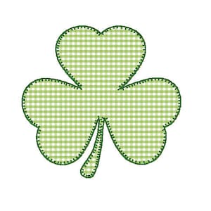 May include: A green shamrock with a gingham pattern. The shamrock is outlined in green.