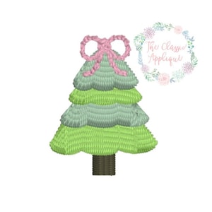 May include: A green and blue Christmas tree with a pink bow on top. The tree is embroidered and has a brown trunk.