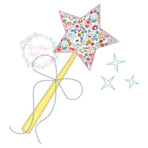 May include: A yellow and floral star-shaped wand with a blue ribbon tied around the handle. Three small blue stars are in the background.