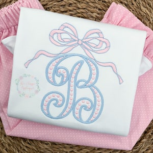 Heirloom satin stitch bow with bean stitch outline machine embroidery design