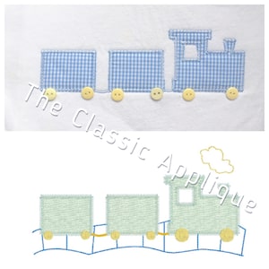 May include: A blue and white gingham train applique with yellow buttons. The train has three cars and a cloud above it. The applique is on a white background.