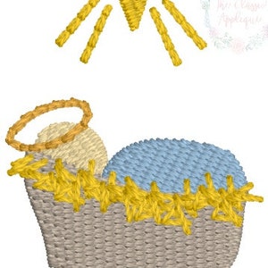 May include: A yellow star with rays of light shining down on a manger with a baby inside. The manger is made of straw and has a blue blanket inside. The baby has a halo above its head.