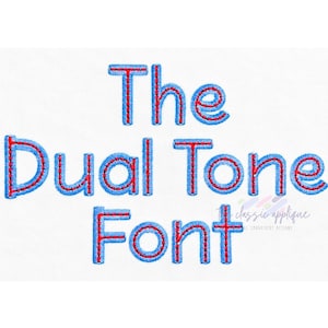 May include: An embroidery design featuring the text The Dual Tone Font in a layered style. The letters have a bright red interior fill with a thick, textured blue stitched outline. A small watermark logo is visible in the lower right corner.
