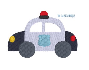 May include: A white toy police car with a red light on top, black wheels, and a blue star on the side. The car is on a white background.