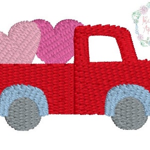 May include: A red truck with a light blue and gray wheel design carries two embroidered hearts, one pink and one fuchsia. The image has a white background and a floral design with text that reads "The Classic Applique".