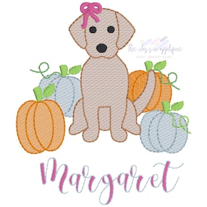 May include: An embroidered design featuring a light brown dog with a pink bow, surrounded by orange and blue pumpkins. The name "Margaret" is written in pink script below the dog and pumpkins.