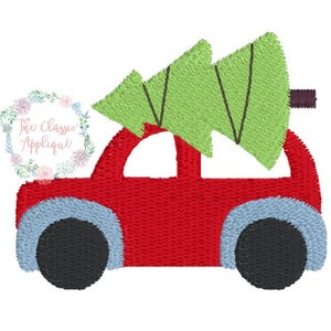 May include: A red car with a green Christmas tree on top. The car has black wheels and a blue trim.