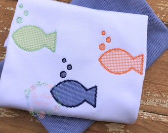 May include: Three embroidered fish with gingham patterns in green, orange, and blue with embroidered bubbles above each fish.