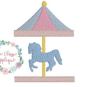 May include: An embroidered design of a carousel with a light blue horse, a pink and light blue striped roof, and a gold pole. The design is on a white background. The Classic Applique logo is in the lower left corner.