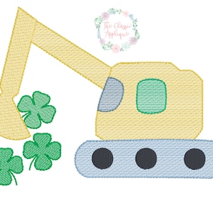 May include: An embroidered design of a yellow excavator scooping up green shamrocks. The excavator has a light blue base and a green window. The design is on a white background.