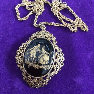 Pendent  black with gold figures signed by Tortolani