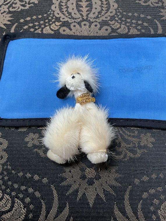 Pin poodle made of mink white.