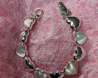 Bracelet with hearts silver in color