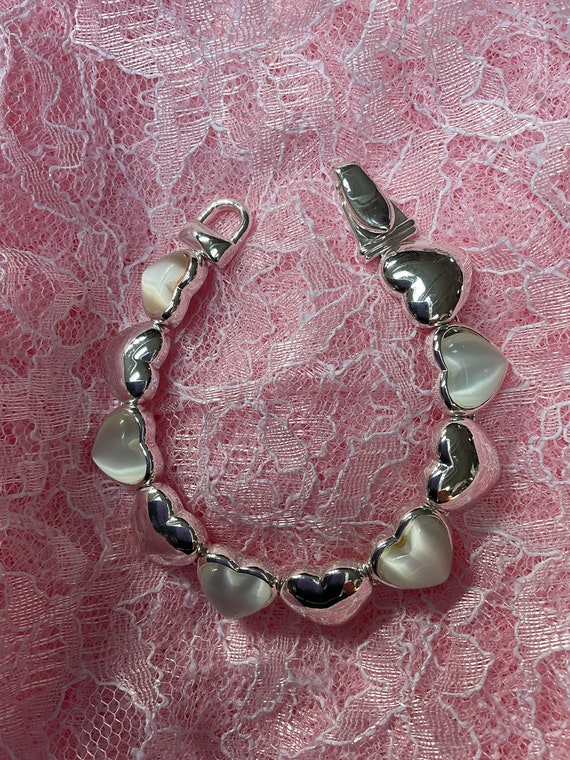 Bracelet with hearts silver in color