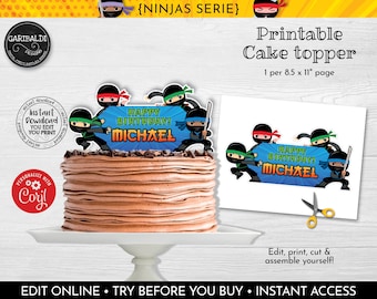May include: Printable cake topper featuring a blue banner with the text "Happy Birthday! Michael" and five cartoon ninjas in black, green, red, and blue. The topper is designed for an 8.5 x 11 inch page.
