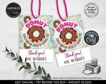 May include: Two gift tags with a donut design and pink string. Each tag has a large donut graphic with the word "DONUT" in pink. The tags say "Thank you! Love, The Miller's". The background has a repeating donut pattern.