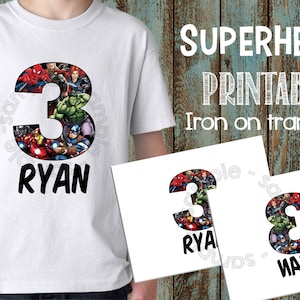 May include: Iron-on transfer design featuring a number 3 made up of images of superheroes, including Spiderman, Hulk, Captain America, and Iron Man. The design also includes the name "Ryan" below the number.