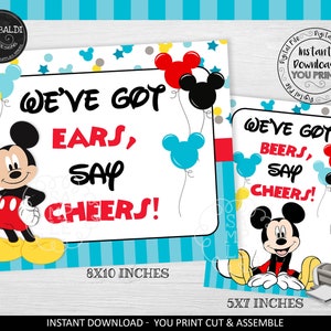 May include: Two printable signs featuring Mickey Mouse with the text "We've got ears, say cheers!" and "We've got beers, say cheers!" The signs are 8x10 inches and 5x7 inches.