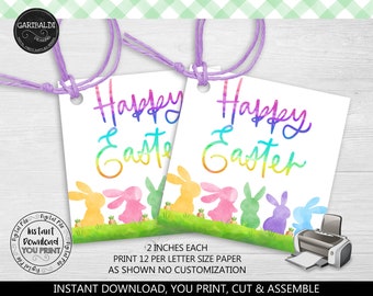 May include: Printable Happy Easter gift tags with watercolor bunny illustrations. The tags are 2 inches wide and feature a rainbow gradient text. The text reads "Happy Easter".