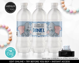 May include: Water bottle labels featuring a cartoon Dumbo the elephant with blue and pink accents. The label says "Happy 1st Birthday! Daniel 10.10.25".