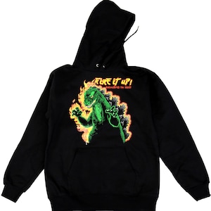 May include: Black hooded sweatshirt featuring a green monster graphic engulfed in flames. The text "Fire it up!" and "Exercising is hot!" is printed on the front of the sweatshirt.