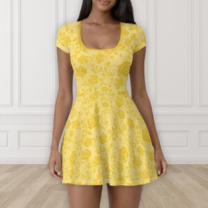 May include: A yellow skater dress with a floral rose pattern. The dress features a scoop neckline and short sleeves. The roses and vines are a lighter shade of yellow against a darker yellow background.