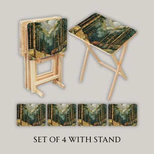 May include: Set of four wooden TV trays with a forest scene design. The trays have a natural wood finish and fold for storage. The set includes a stand. The forest scene features tall trees, mountains, and a river. The text on the image says "SET OF 4 WITH STAND".